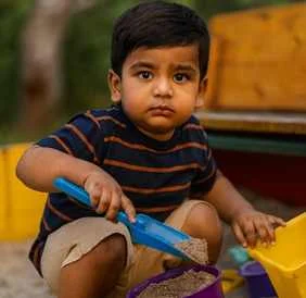 Child playing with sand